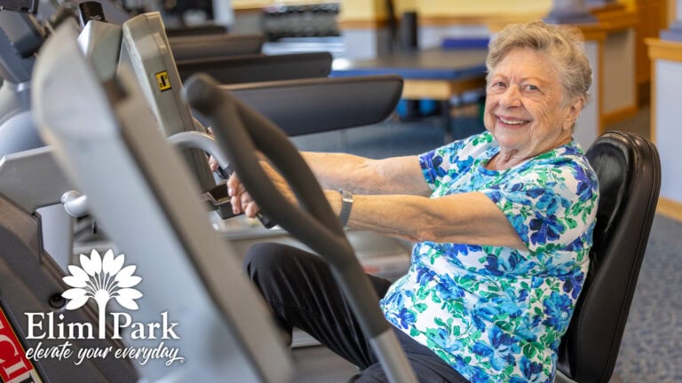 Barbara using fitness equipment at the Elim Park wellness center.
