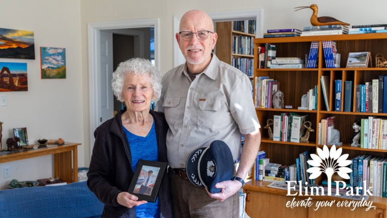 Elim Park resident Clay with his wife sharing memories of their travels in their Independent Living apartment.